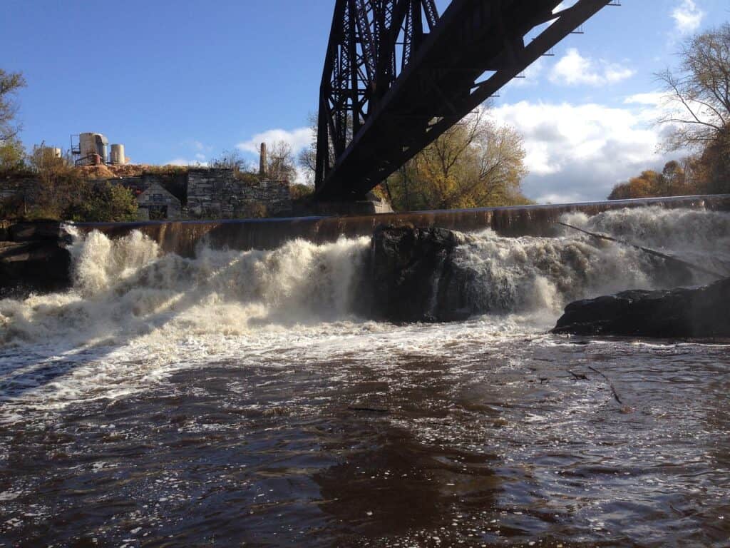 Bridge in Rutland, Vermont with roaring water underneath